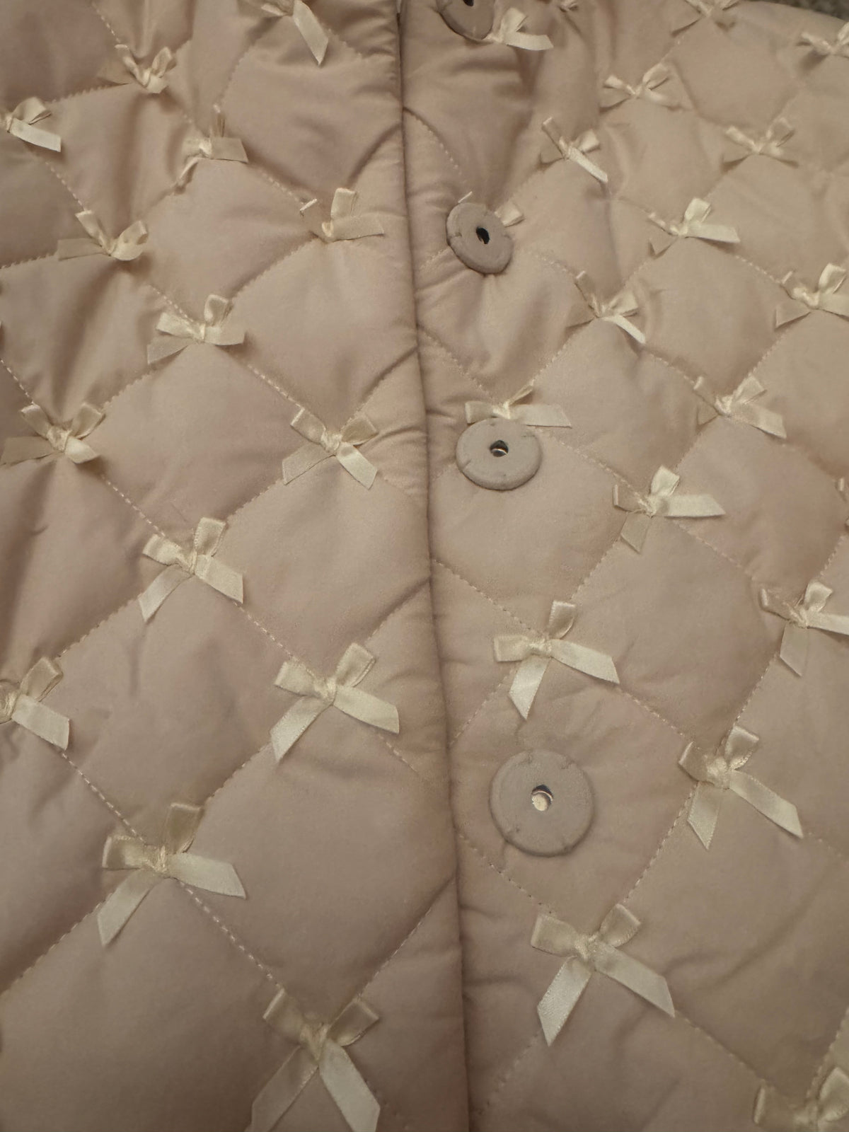 WRAPPED IN BOWS quilted jacket in winter white
