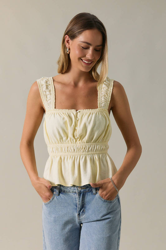 April SHIP SLEEVELESS PEPLUM TOP